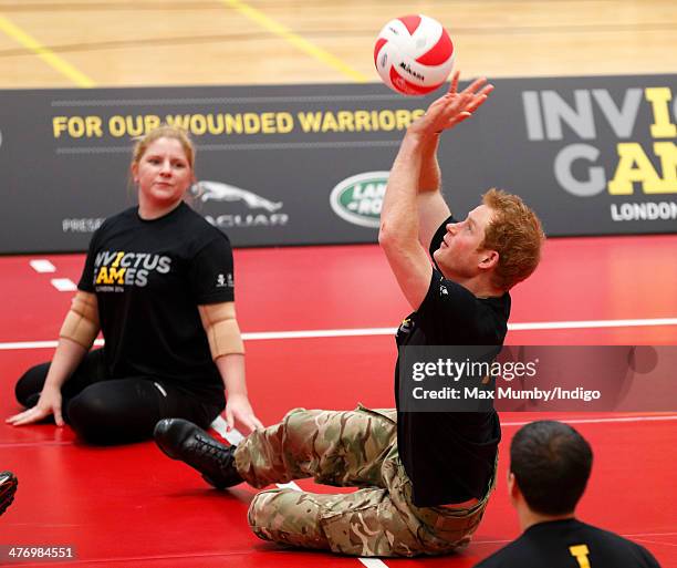 Prince Harry plays sitting Volleyball during the launch of the Invictus Games at the Copper Box Arena in the Queen Elizabeth Olympic Park on March 6,...