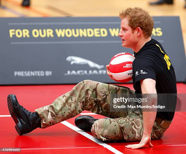 Prince Harry plays sitting Volleyball during the launch of the Invictus Games at the Copper Box Arena in the Queen Elizabeth Olympic Park on March 6,...