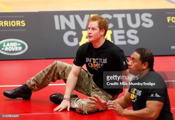 Prince Harry plays sitting Volleyball during the launch of the Invictus Games at the Copper Box Arena in the Queen Elizabeth Olympic Park on March 6,...