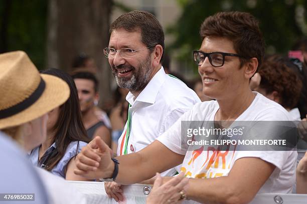 Rome's Mayor Ignazio Marino and gay rights activist Imma Battaglia take part in the Gay Pride Parade with their children on June 13, 2015 in Rome....