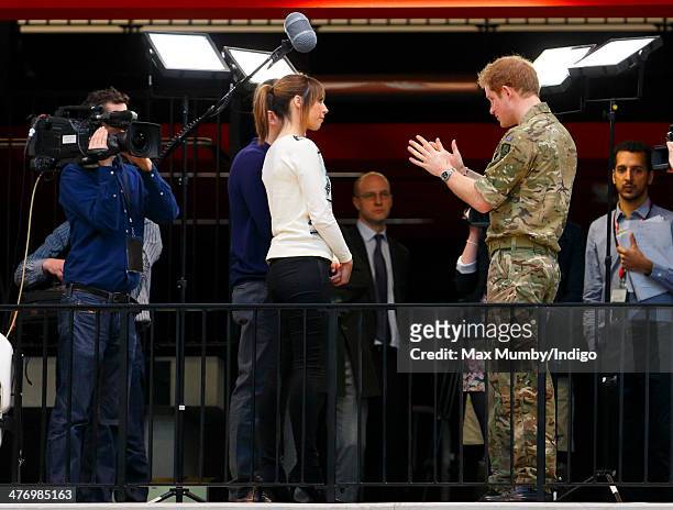 Alex Jones, presenter of The One Show, interviews Prince Harry during the launch of the Invictus Games at the Copper Box Arena in the Queen Elizabeth...