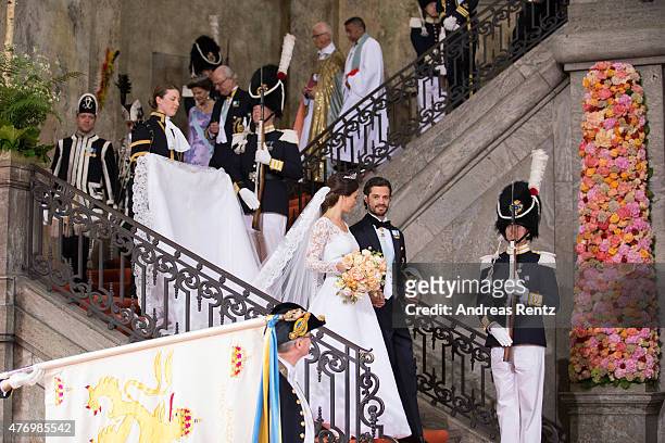 King Carl XVI Gustaf of Sweden and Queen Silvia of Sweden follow down the stairs Prince Carl Philip of Sweden and his wife Princess Sofia of Sweden...