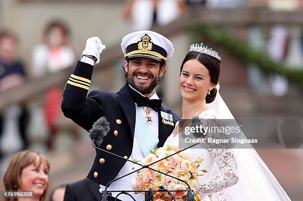 Prince Carl Philip of Sweden and his wife Princess Sofia of Sweden salute the crowd after their marriage ceremony on June 13, 2015 in Stockholm,...