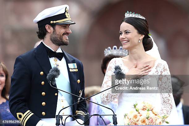 Prince Carl Philip of Sweden and his wife Princess Sofia of Sweden salute the crowd after their marriage ceremony on June 13, 2015 in Stockholm,...
