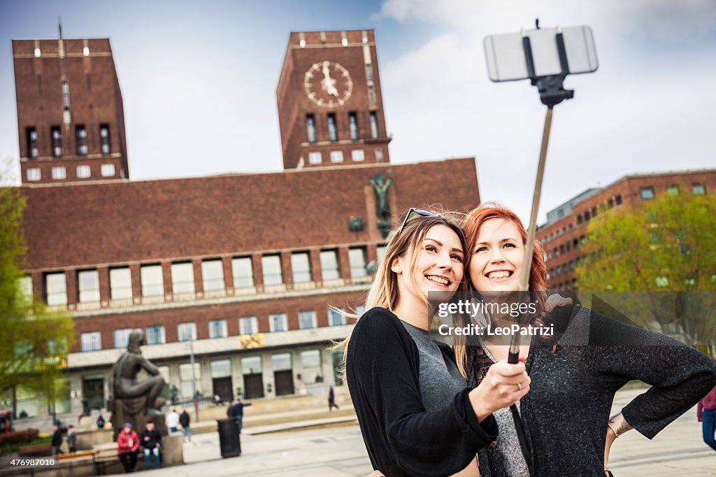 Friends on travel taking a selfie on mobile