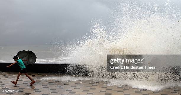 Children enjoying the high tide at Worli Sea face on June 13, 2015 in Mumbai, India. Heavy rains caused major water logging in many areas on...