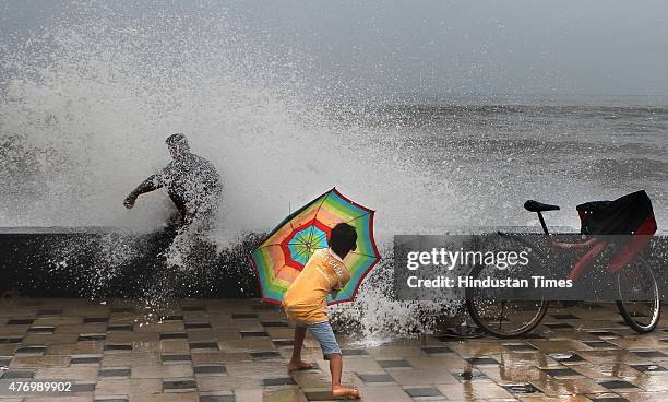 Children enjoying the high tide at Worli Sea face on June 13, 2015 in Mumbai, India. Heavy rains caused major water logging in many areas on...