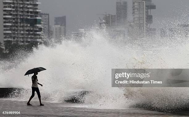 Children enjoying the high tide at Worli Sea face on June 13, 2015 in Mumbai, India. Heavy rains caused major water logging in many areas on...