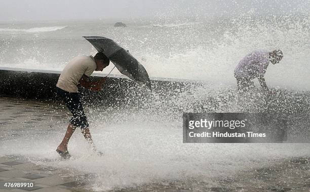 Children enjoying the high tide at Worli Sea face on June 13, 2015 in Mumbai, India. Heavy rains caused major water logging in many areas on...