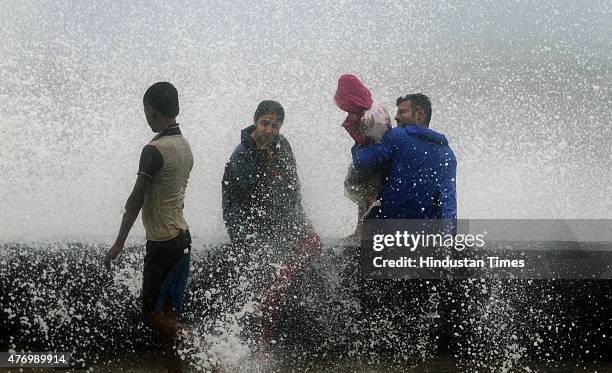 Children enjoying the high tide at Worli Sea face on June 13, 2015 in Mumbai, India. Heavy rains caused major water logging in many areas on...