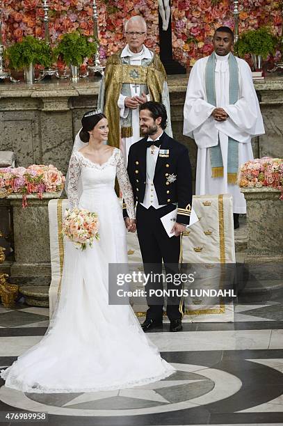 Sweden's Prince Carl Philip and Sofia Hellqvist's stand at the alter during their wedding ceremony at the Royal Chapel in Stockholm Palace on June...