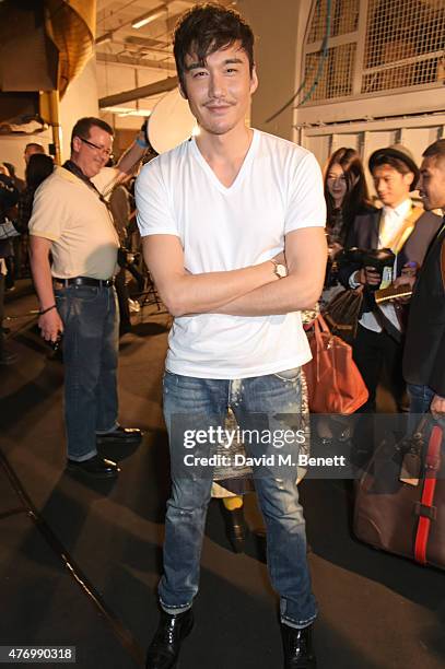 Hu Bing attends the front row at the Oliver Spencer show during London Collections Men SS16 at The Old Sorting Office on June 13, 2015 in London,...