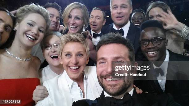 In this handout photo provided by Ellen DeGeneres, host Ellen DeGeneres poses for a selfie taken by Bradley Cooper with Jared Leto, Jennifer...