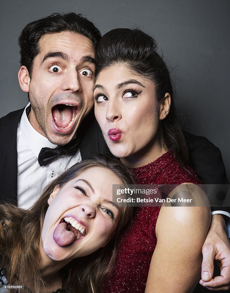Friends pulling faces for photo.
