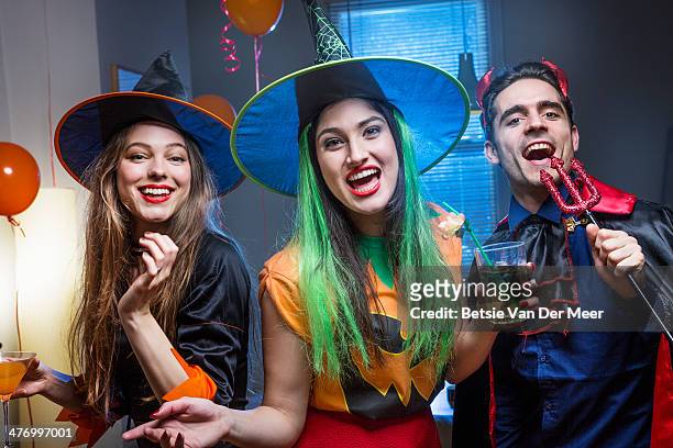 halloween witches and devil singing and laughing. - party with the devil stock pictures, royalty-free photos & images
