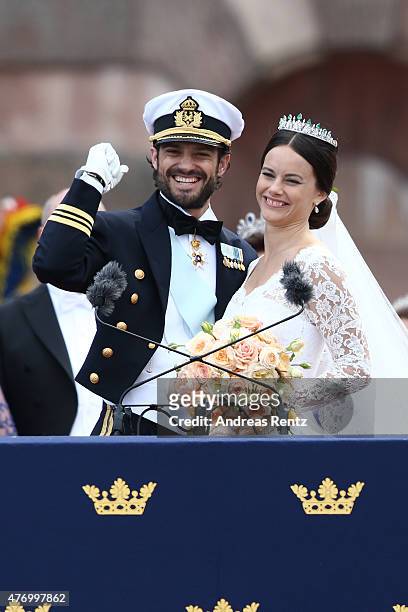 Prince Carl Philip of Sweden and HRH Princess Sofia, Duchess of Varmland ride in the wedding cortege after their marriage ceremony on June 13, 2015...
