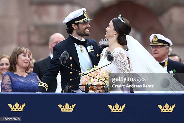 Prince Carl Philip of Sweden and HRH Princess Sofia, Duchess of Varmland ride in the wedding cortege after their marriage ceremony on June 13, 2015...