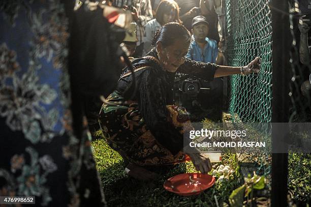 Jupirin Gombur a shaman from the Kadazan-Dusun tribe offers prayers during the Monolibabow rituals in Damat, in the district of Tamparuli, in...
