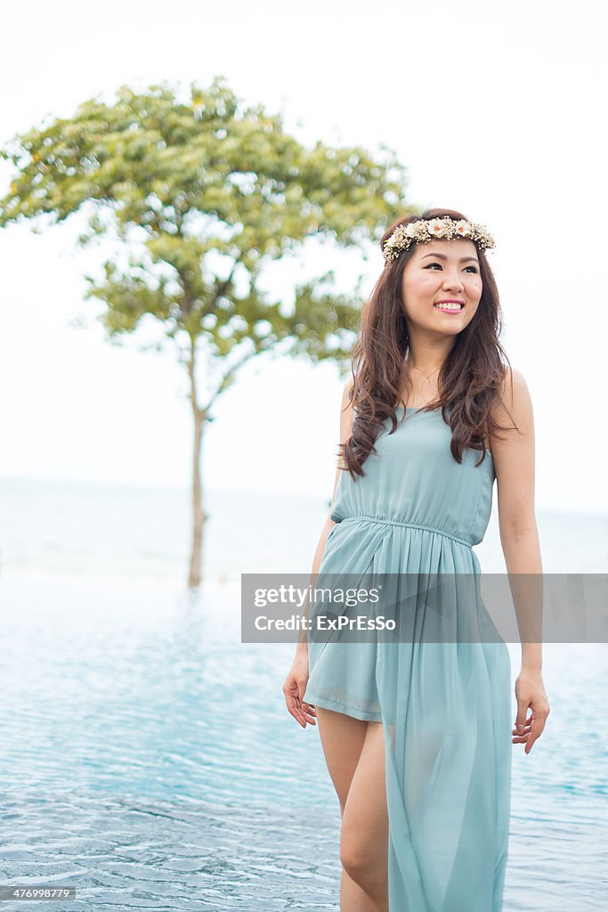 Woman standing at edge of infinity pool