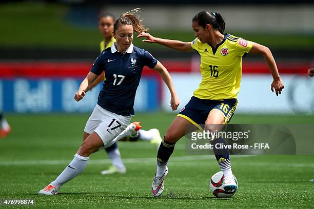 Lady Andrade of Colombia is challenged by Gaetane Thiney of France during the FIFA Women's World Cup 2015 Group F match between France and Colombia...