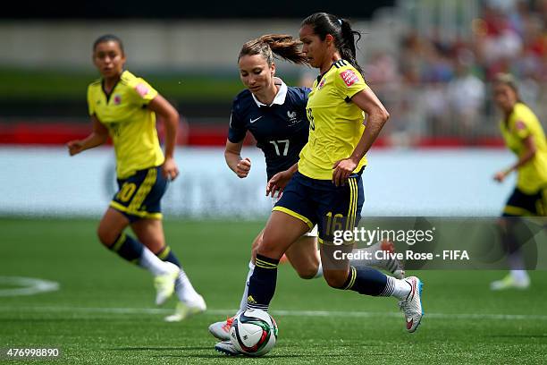 Lady Andrade of Colombia is challenged by Gaetane Thiney of France during the FIFA Women's World Cup 2015 Group F match between France and Colombia...