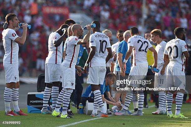 Players of France take a drink during the international friendly match between Albania and France at Elbasan Arena on June 13, 2015 in Elbasan,...