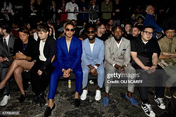 British Formula One racing driver Lewis Hamilton waits for the start of the fashion show by designer Casely-Hayford on the second day of the...