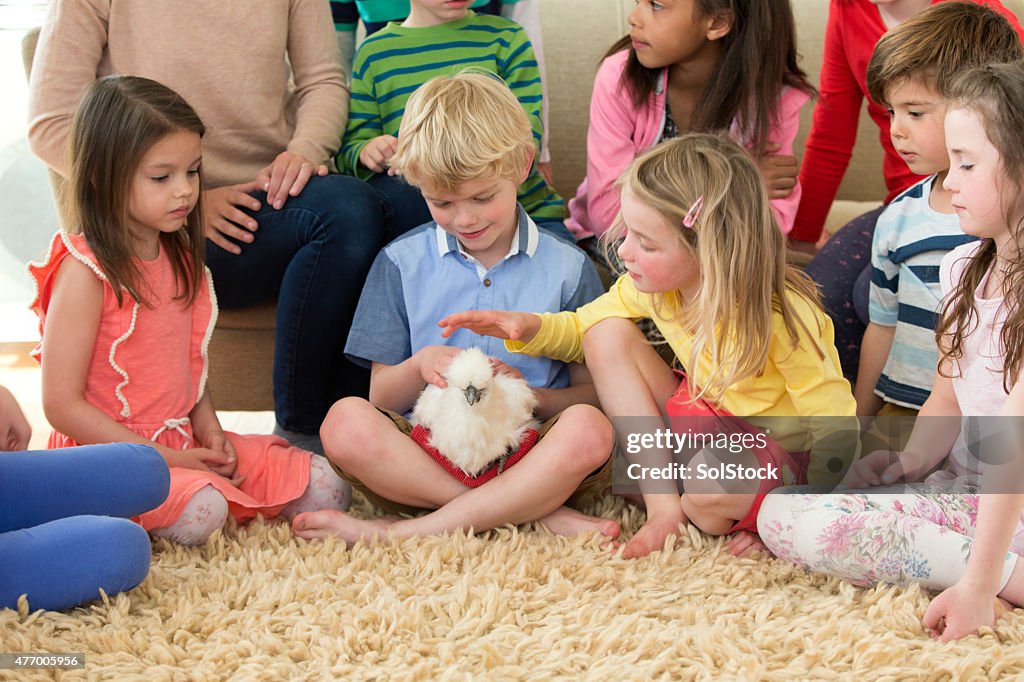 Children With A Pet Chicken
