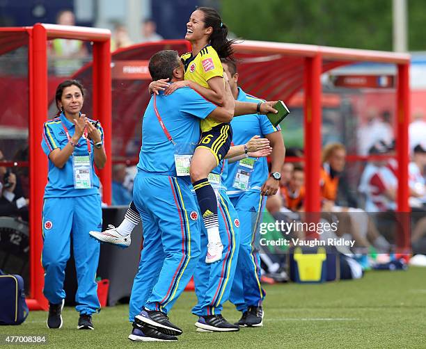 Lady Andrade of Colombia celebrates her goal with coaches during the FIFA Women's World Cup Group F match between France and Colombia at Moncton...