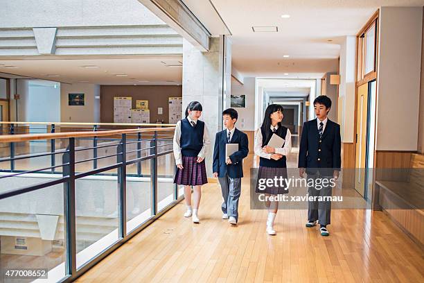 japanese students walking in the school corridors - japanese school uniform stock pictures, royalty-free photos & images