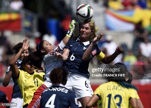 France's midfielder Amandine Henry vies with Colombia's goalkeeper Sandra Sepulveda during a Group F match at the 2015 FIFA Women's World Cup between...