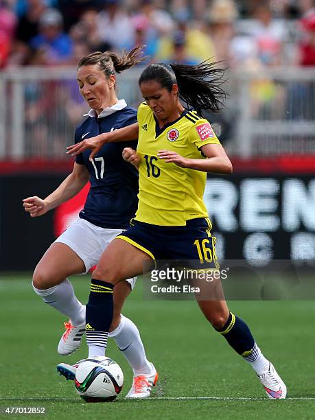 Lady Andrade of Colombia and Gaetane Thiney of France fight for the ball in the first half during the FIFA Women's World Cup 2015 Group F match at...