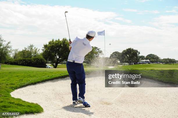 Kevin Streelman hits out of a bunker on the second hole during the first round of the World Golf Championships-Cadillac Championship at Blue Monster,...