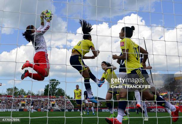 Colombia's goalkeeper Sandra Sepulveda stops the ball during a Group F match at the 2015 FIFA Women's World Cup between France and Colombia at...
