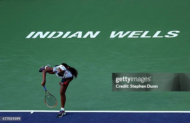 Victoria Duval serves to Alisa Kleybanova of Russia during the BNP Paribas Open at Indian Wells Tennis Garden on March 6, 2014 in Indian Wells,...