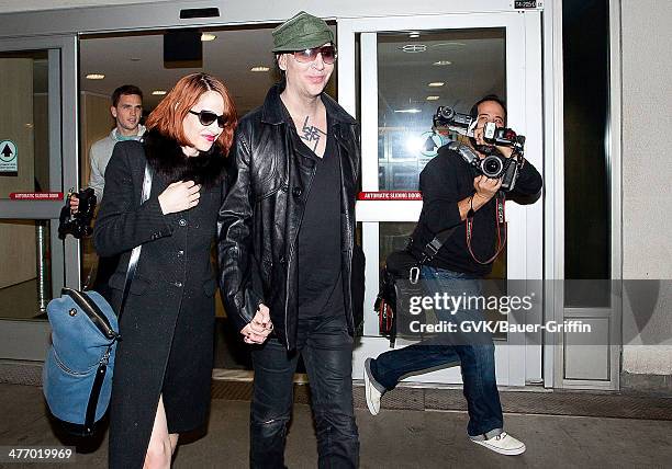 Marilyn Manson and Lindsay Usich are seen at LAX on November 14, 2012 in Los Angeles, California.