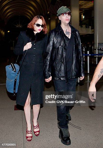 Marilyn Manson and Lindsay Usich are seen at LAX on November 14, 2012 in Los Angeles, California.