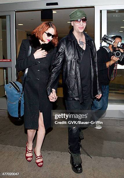 Marilyn Manson and Lindsay Usich are seen at LAX on November 14, 2012 in Los Angeles, California.