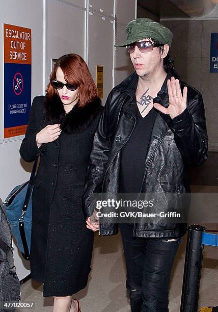 Marilyn Manson and Lindsay Usich are seen at LAX on November 14, 2012 in Los Angeles, California.