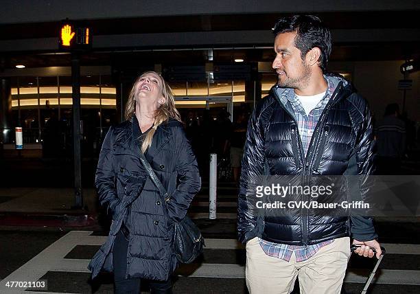 Julie Benz with her husband Rich Orosco are seen at LAX on November 30, 2012 in Los Angeles, California.