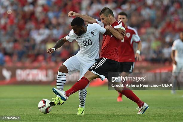 Lorik Cana of Albania competes with Alexandre Lacazette of France during the international friendly match between Albania and France at Elbasan Arena...