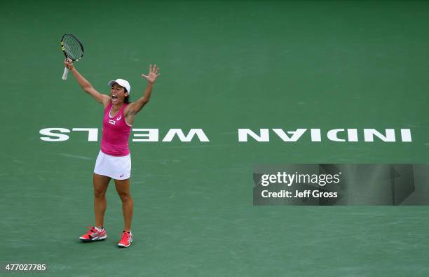 Francesca Schiavone of Italy celebrates after breaking Mona Barthel of Germany in the first set during the BNP Paribas Open at Indian Wells Tennis...