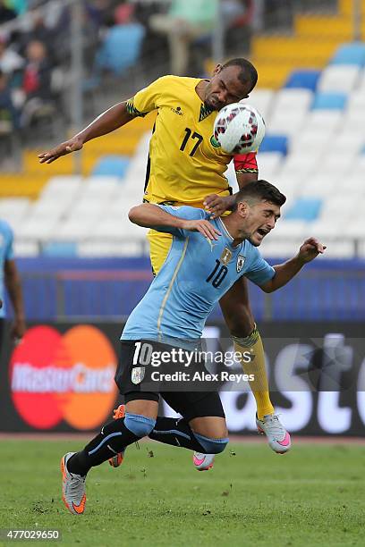 Rodolph Austin of Jamaica goes for a header with Giorgian de Arrascaeta of Uruguay during the 2015 Copa America Chile Group B match between Uruguay...