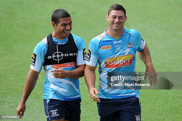 David Mead and Mark Minichiello share a laugh during a Gold Coast Titans NRL training session at cbus Super Stadium on March 7, 2014 on the Gold...