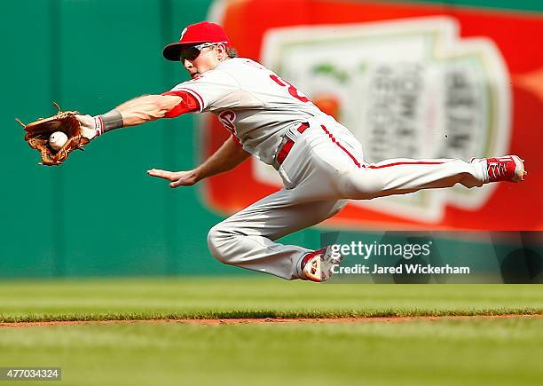 Chase Utley of the Philadelphia Phillies fields a ground ball while midair in the second inning against the Pittsburgh Pirates during the game at PNC...