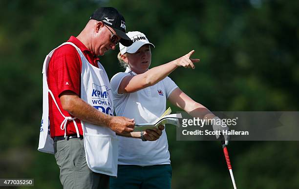Stacy Lewis chats with her caddie Travis Wilson on the 18th hole during the third round of the KPMG Women's PGA Championship on the West Course at...