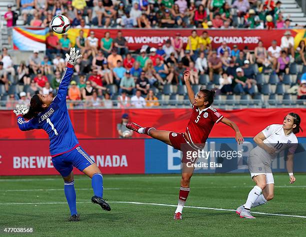 Karen Carney of England gets a shot past Valeria Miranda and Cecilia Santiago of Mexico in the second half during the FIFA Women's World Cup 2015...