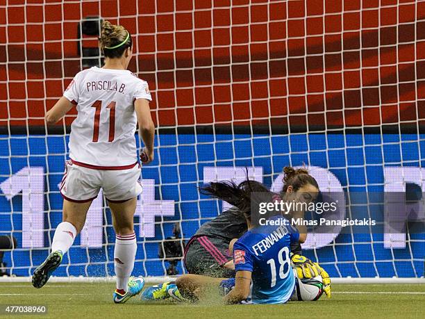 Goalkeeper Ainhoa Tirapu of Spain dives to make a save on Raquel Fernandes of Brazil during the 2015 FIFA Women's World Cup Group E match at Olympic...