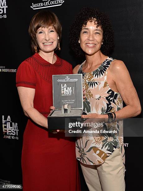 Honoree Gale Anne Hurd and LA Film Festival Director Stephanie Allain pose with the Glory To The Filmmaker award at Women Who Make It Happen: Gale...