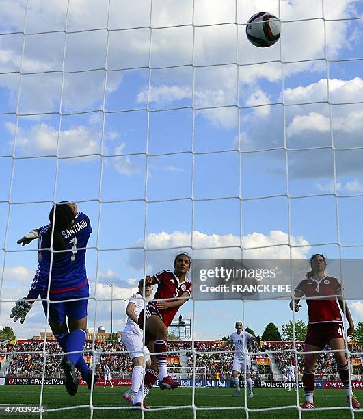 England's forward Karen Carney scores a goal next to Mexico's defender Valeria Miranda and Mexico's goalkeeper Cecilia Santiago during a Group F...